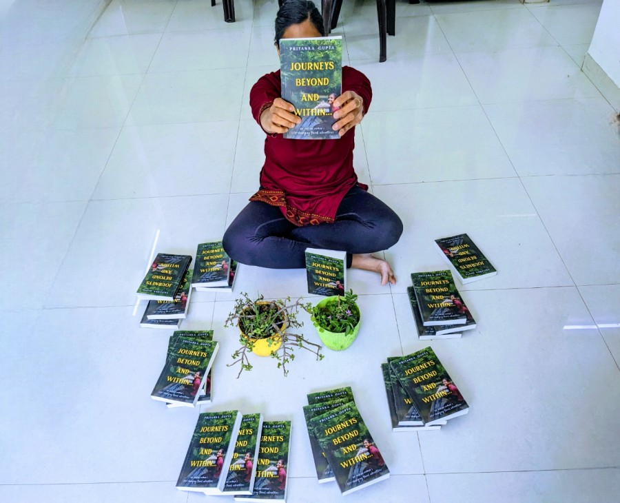 feature a girl holding a book called Journeys beyond and within surrounded by many copies of the book in a home (1)